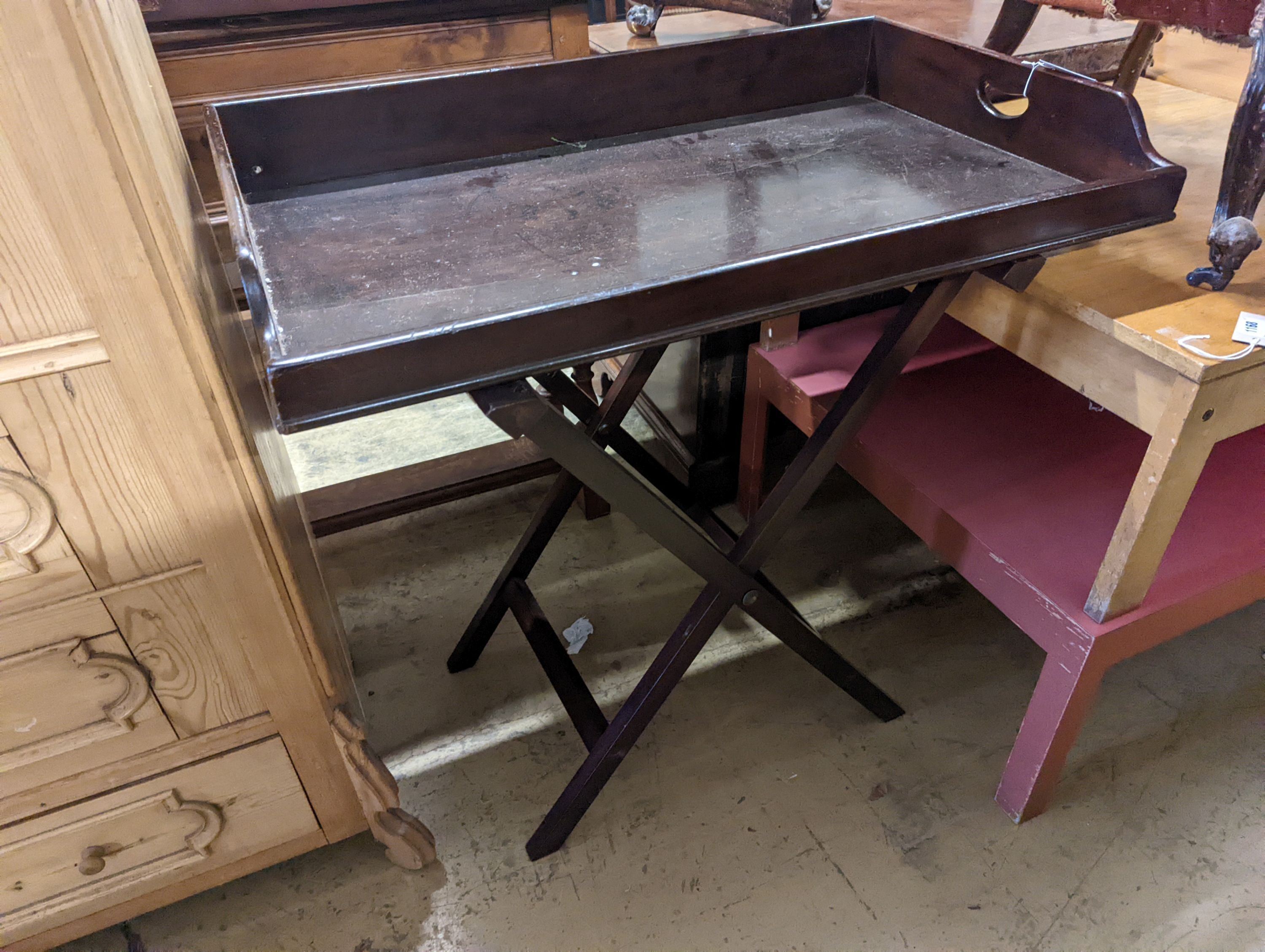 A large 19th century rectangular mahogany butler's tray on folding stand, width 89cm, depth 54cm